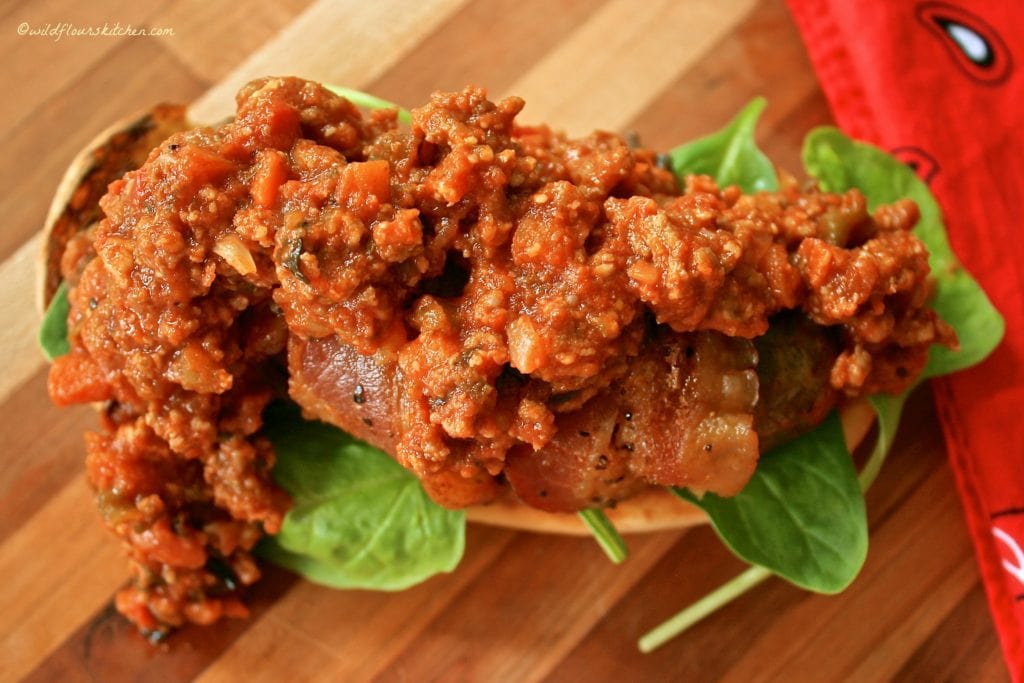 bolognese topped bacon brat