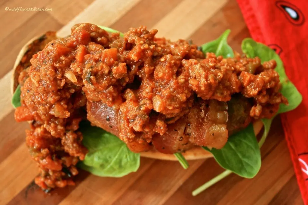 bolognese topped bacon brat